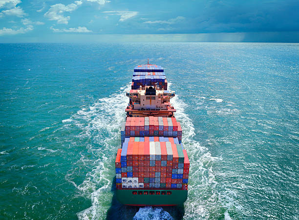 Aerial view of freight ship with cargo containers on the sea. See similar photos: :  http://www.oc-photo.net/FTP/icons/cargo.jpg