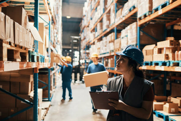 Close up of a group of workers working in a warehouse